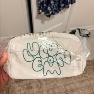 Lululemon NWT Bone White Crossbody Embroidered Blue Teal Logo Bag
